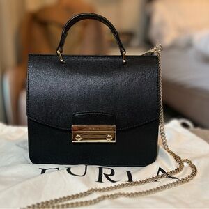 Furla leather top handle bag in black. Almost new condition.